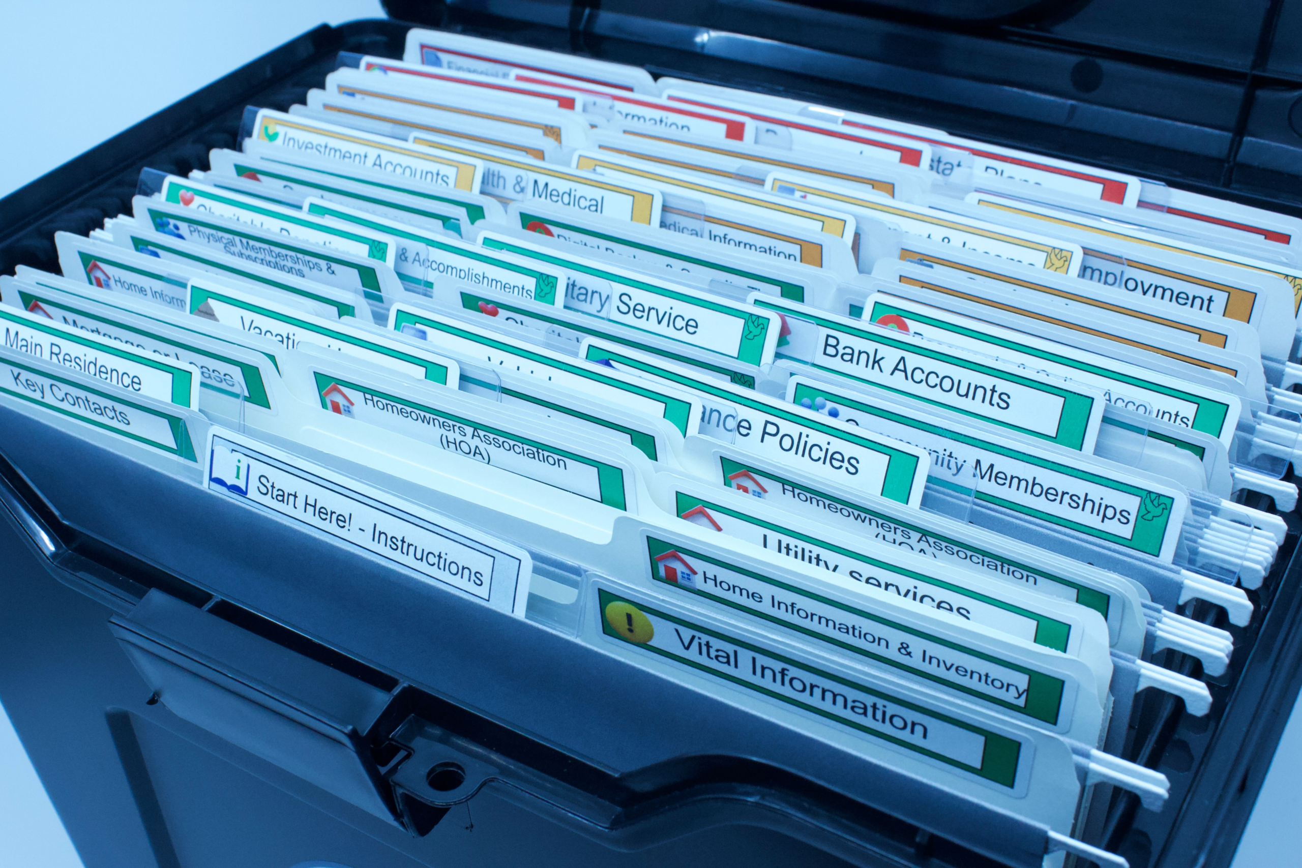 The Orderly Affairs kit open, showing color-coded labeled folders for bank accounts, insurance policies, vital information, and more
